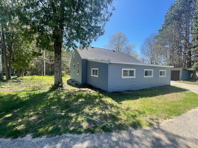 519 Whaley St, Cadillac, MI 49601 - view of property exterior featuring a yard