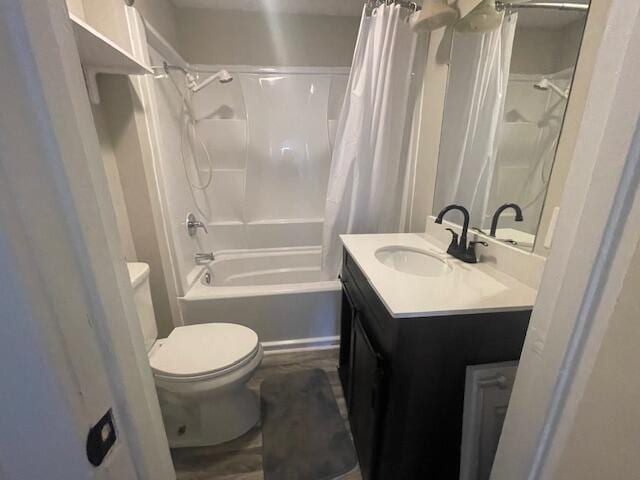 519 Whaley St, Cadillac, MI 49601 - full bath featuring toilet, vanity, and shower / bath combo with shower curtain