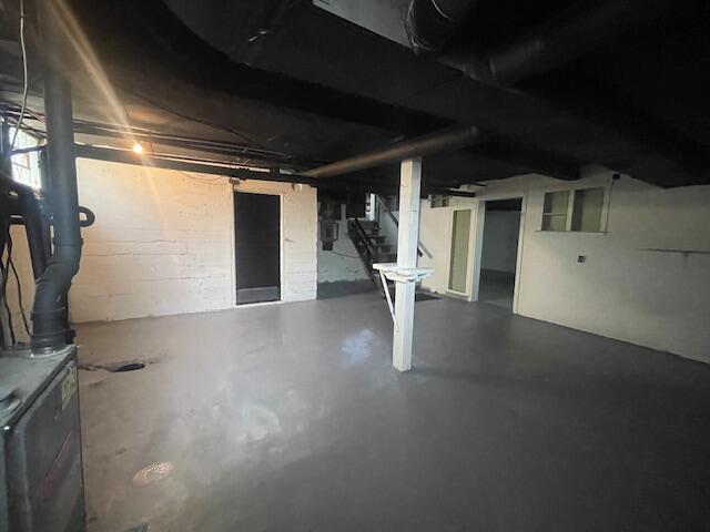 519 Whaley St, Cadillac, MI 49601 - unfinished below grade area featuring stairway