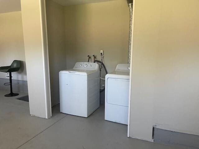 519 Whaley St, Cadillac, MI 49601 - laundry area with washing machine and clothes dryer