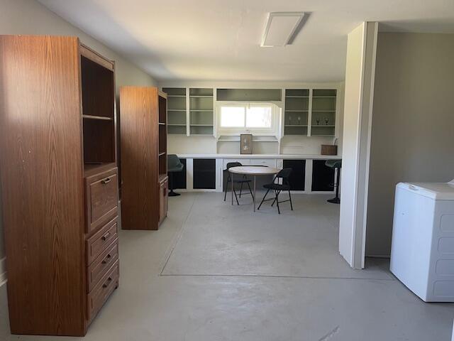 519 Whaley St, Cadillac, MI 49601 - home office with washer / dryer and concrete flooring