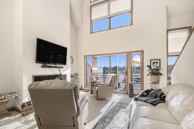 409 Lake Dr Unit 10, New Buffalo, MI 49117 - living area featuring a towering ceiling and carpet