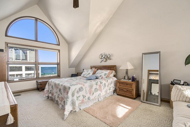 409 Lake Dr Unit 10, New Buffalo, MI 49117 - bedroom featuring carpet floors, high vaulted ceiling, ceiling fan, and baseboards