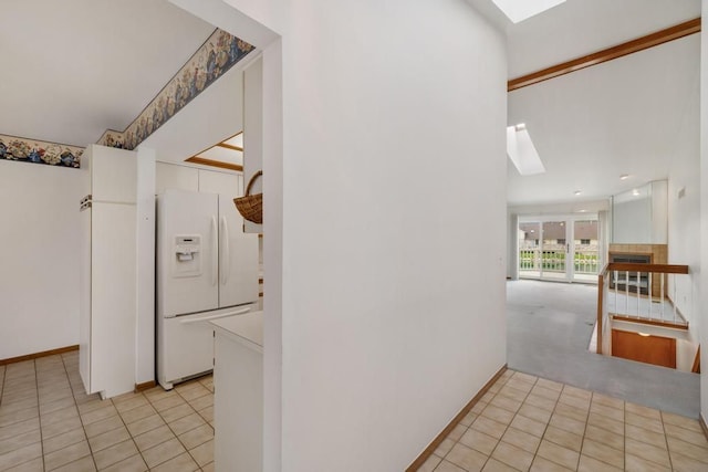 43389 Riverbend Blvd, Clinton Township, MI 48038 - hallway with a skylight, light tile patterned floors, and baseboards