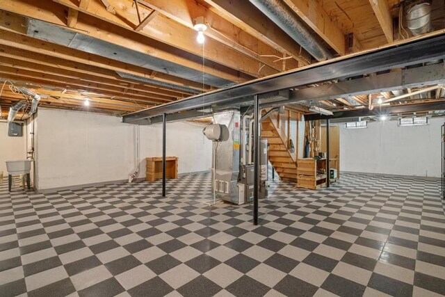 43389 Riverbend Blvd, Clinton Township, MI 48038 - basement featuring tile patterned floors, stairway, water heater, and heating unit