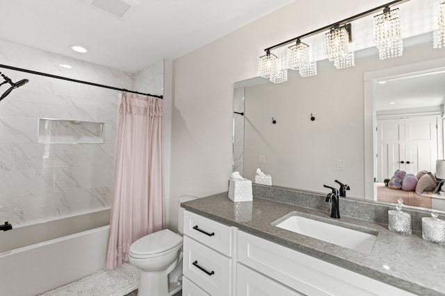 bathroom with toilet, shower / bath combo with shower curtain, vanity, and recessed lighting