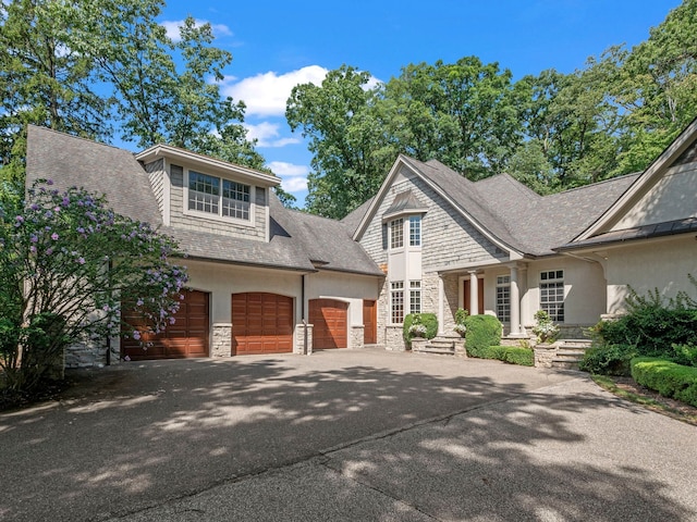 3418 Westchester Rd, Bloomfield Hills, MI 48304 - view of front facade featuring stone siding, stucco siding, asphalt driveway, and an attached garage