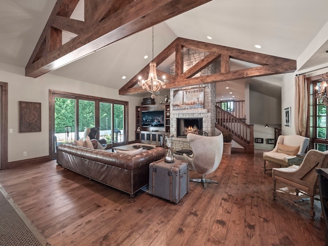 3418 Westchester Rd, Bloomfield Hills, MI 48304 - living area featuring a chandelier, a stone fireplace, dark wood-style floors, baseboards, and high vaulted ceiling