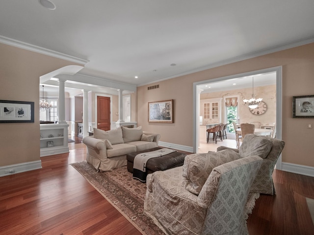3418 Westchester Rd, Bloomfield Hills, MI 48304 - living room featuring decorative columns, ornamental molding, a chandelier, baseboards, and wood finished floors