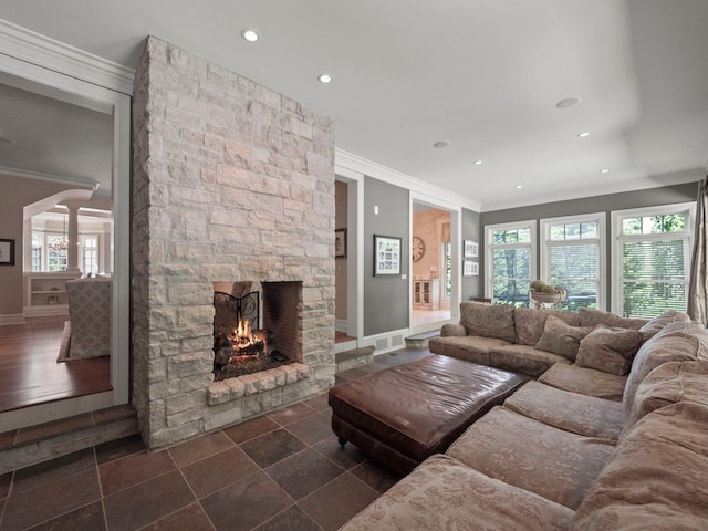 3418 Westchester Rd, Bloomfield Hills, MI 48304 - living area featuring crown molding, baseboards, a stone fireplace, healthy amount of natural light, and recessed lighting