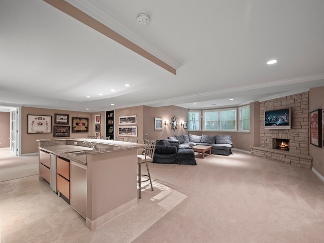 3418 Westchester Rd, Bloomfield Hills, MI 48304 - kitchen with open floor plan, crown molding, a fireplace, light colored carpet, and recessed lighting
