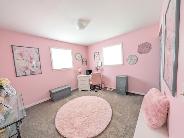 carpeted office space featuring baseboards