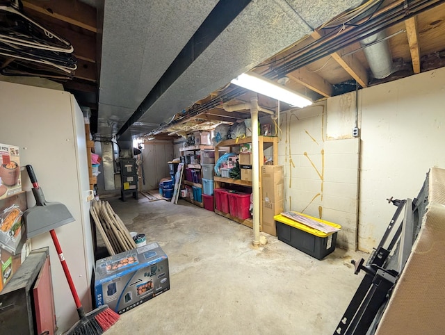 unfinished basement featuring heating unit