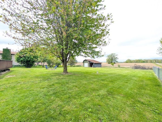 view of yard featuring an outbuilding and a detached garage