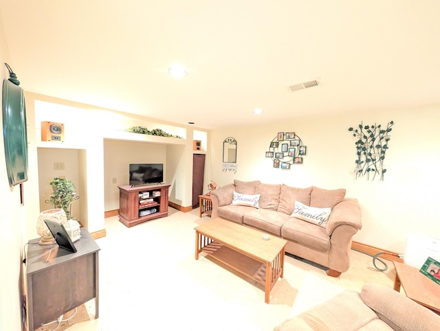 living room with light colored carpet and recessed lighting