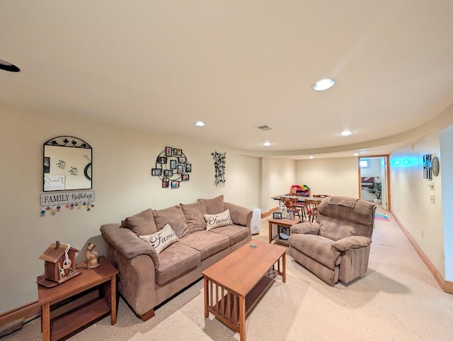 living room featuring recessed lighting and baseboards