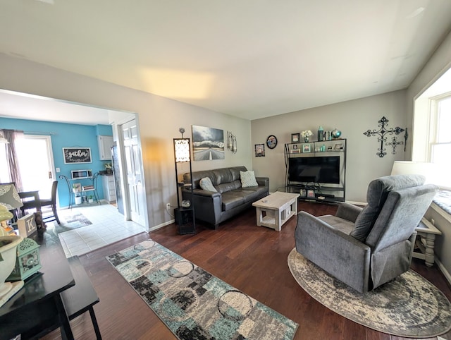 living room with plenty of natural light and wood finished floors
