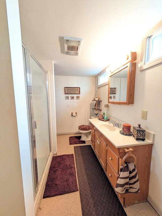 full bathroom featuring vanity and a shower stall