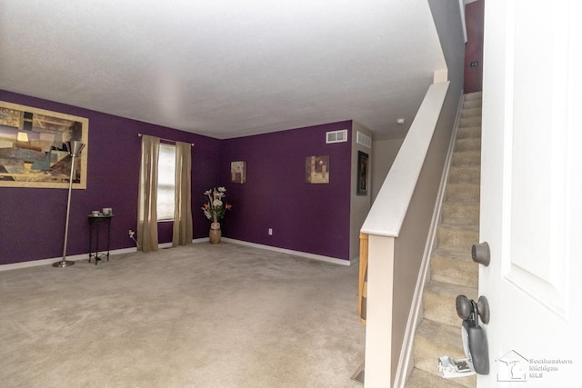 1786 Arbor Creek Dr, Monroe, MI 48162 - foyer entrance featuring stairs, baseboards, and light carpet