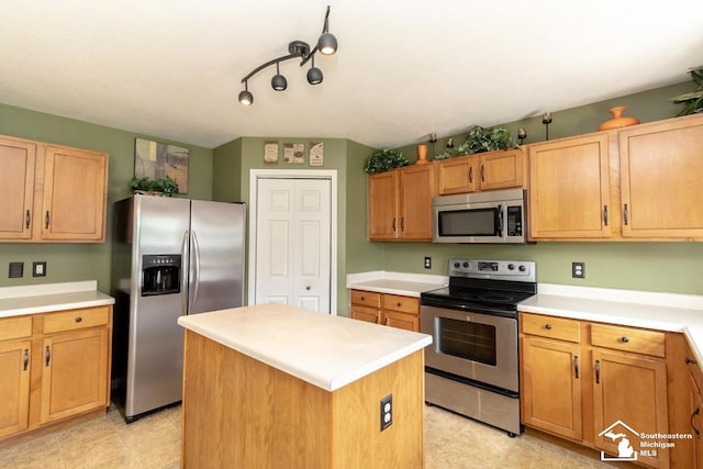 1786 Arbor Creek Dr, Monroe, MI 48162 - kitchen with stainless steel appliances, light countertops, a center island, and light tile patterned floors
