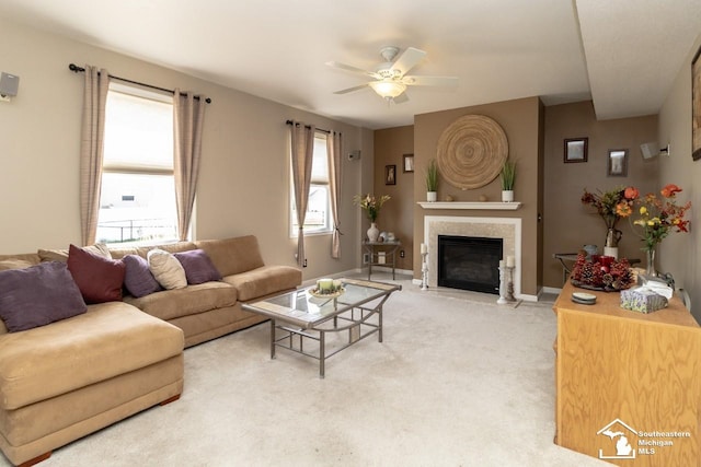 1786 Arbor Creek Dr, Monroe, MI 48162 - living area with ceiling fan, a fireplace with flush hearth, light colored carpet, and baseboards
