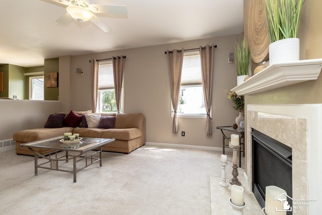 1786 Arbor Creek Dr, Monroe, MI 48162 - carpeted living room with healthy amount of natural light, a ceiling fan, baseboards, and a fireplace
