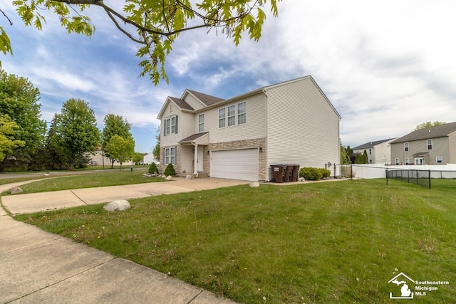 1786 Arbor Creek Dr, Monroe, MI 48162 - view of front facade featuring stone siding, an attached garage, and driveway
