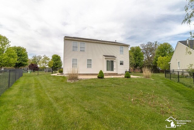 1786 Arbor Creek Dr, Monroe, MI 48162 - rear view of house with a patio area
