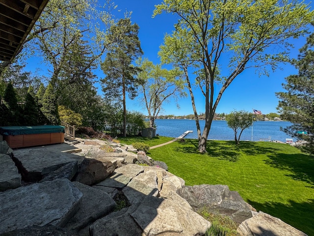 2660 Silverdown Ct, Waterford, MI 48328 - view of grassy yard with a hot tub and a water view