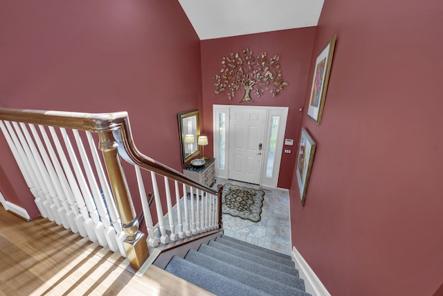 2660 Silverdown Ct, Waterford, MI 48328 - entrance foyer with high vaulted ceiling, stairs, and baseboards
