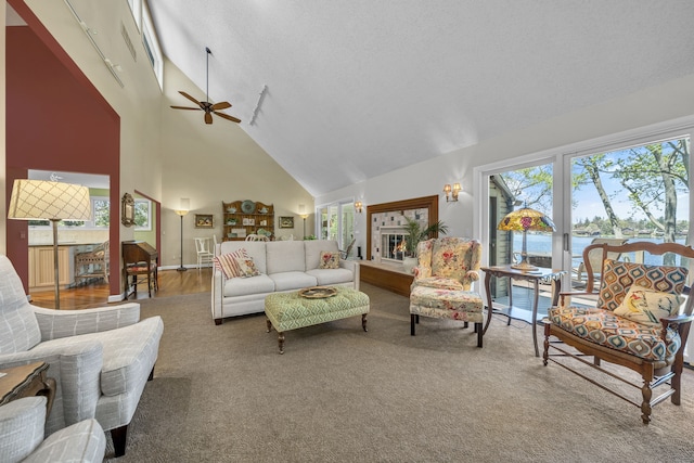 2660 Silverdown Ct, Waterford, MI 48328 - carpeted living area with high vaulted ceiling, ceiling fan, a water view, and a textured ceiling