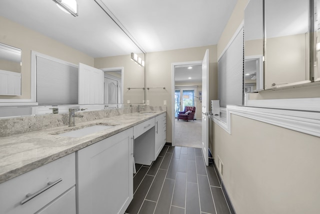 2660 Silverdown Ct, Waterford, MI 48328 - bathroom featuring double vanity and recessed lighting