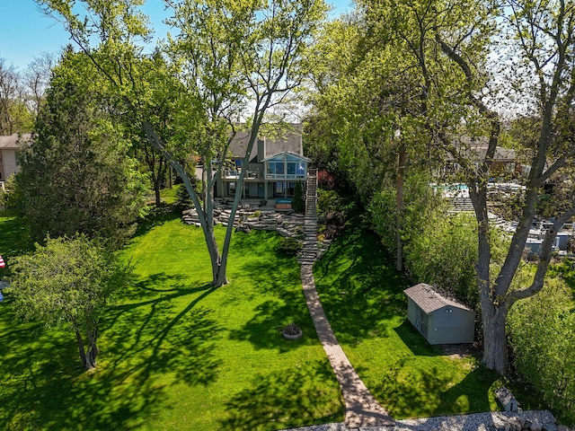 2660 Silverdown Ct, Waterford, MI 48328 - view of green lawn with stairs and a wooden deck