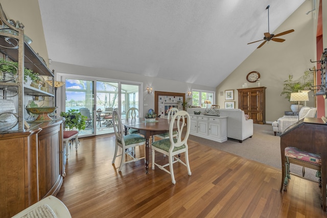 2660 Silverdown Ct, Waterford, MI 48328 - dining space featuring wood finished floors, high vaulted ceiling, and ceiling fan