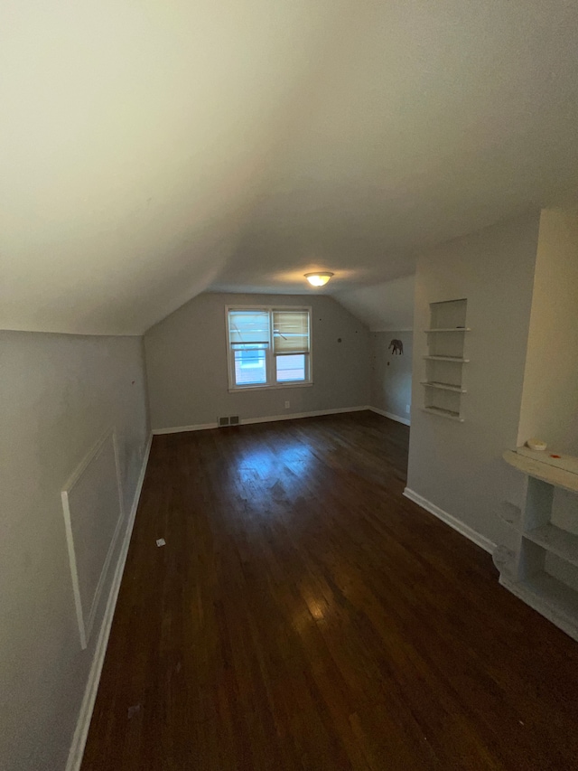 11336 Minock St, Detroit, MI 48228 - additional living space featuring dark wood finished floors, baseboards, and lofted ceiling
