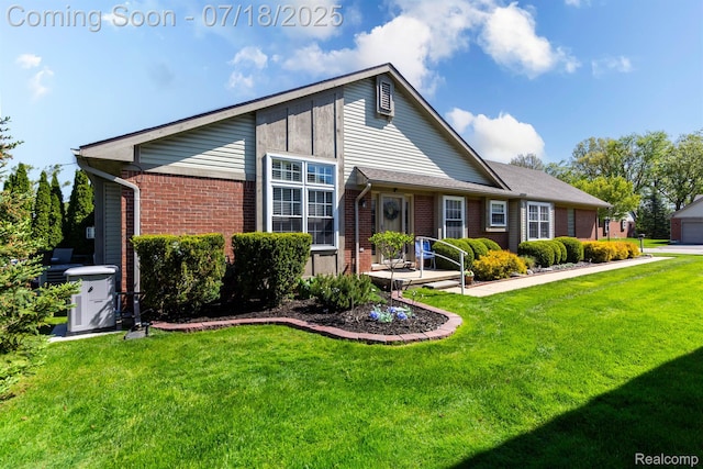 25380 Tara Ln, Flat Rock, MI 48134 - view of front of property with brick siding and a front lawn