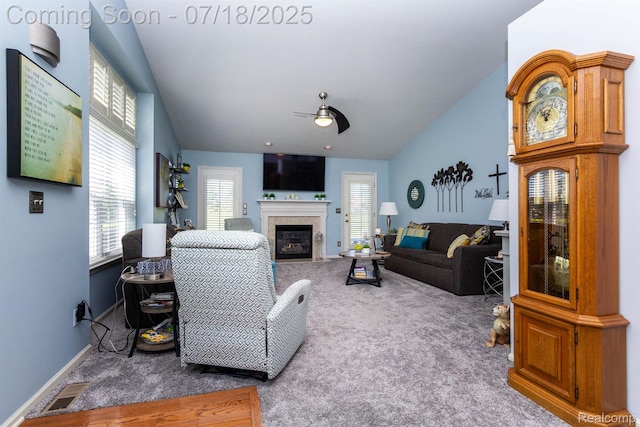 25380 Tara Ln, Flat Rock, MI 48134 - living area with a ceiling fan, carpet, plenty of natural light, and a fireplace with flush hearth