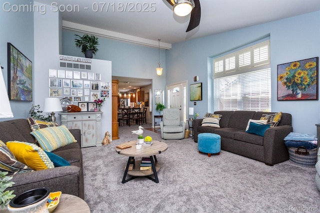25380 Tara Ln, Flat Rock, MI 48134 - carpeted living area featuring ceiling fan and a towering ceiling