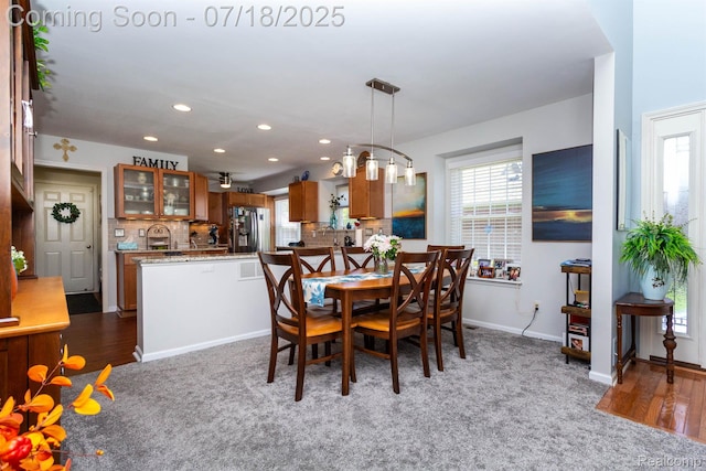25380 Tara Ln, Flat Rock, MI 48134 - dining space featuring recessed lighting, carpet floors, and wood finished floors