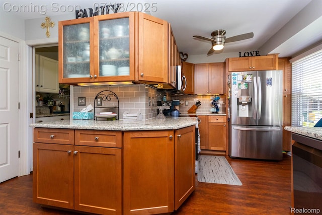 25380 Tara Ln, Flat Rock, MI 48134 - kitchen with appliances with stainless steel finishes, ceiling fan, decorative backsplash, and dark wood-style flooring