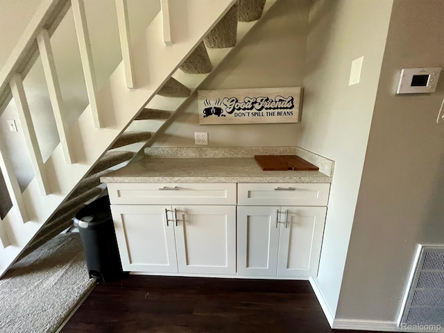 6210 Tennis Ct Unit D-11, Bay City, MI 48706 - bar featuring dark wood-type flooring