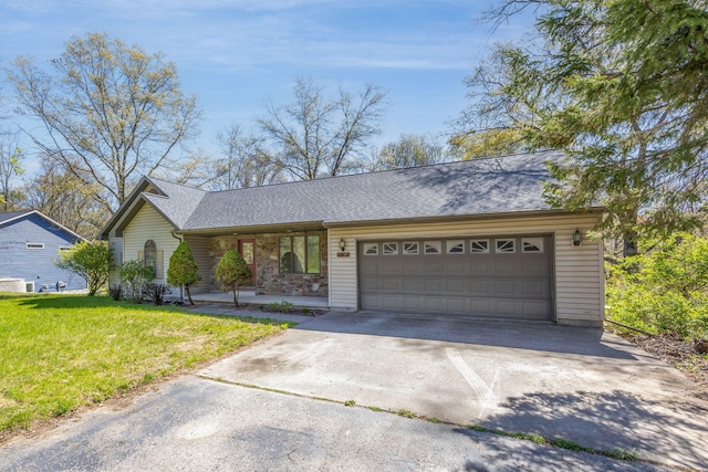 11021 Heather Ln, Canadian Lakes, MI 49346 - view of front of home with concrete driveway, an attached garage, a front yard, and roof with shingles