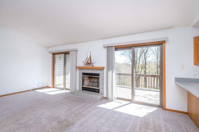 11021 Heather Ln, Canadian Lakes, MI 49346 - unfurnished living room with carpet, a fireplace, and baseboards