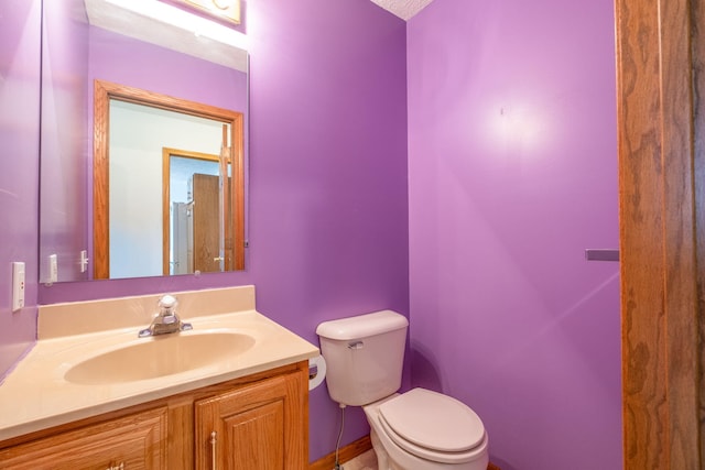 11021 Heather Ln, Canadian Lakes, MI 49346 - half bathroom featuring toilet and vanity
