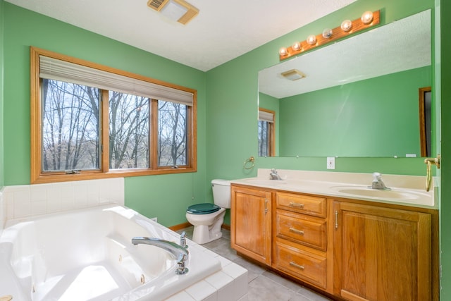 11021 Heather Ln, Canadian Lakes, MI 49346 - bathroom featuring toilet, a whirlpool tub, healthy amount of natural light, and tile patterned flooring
