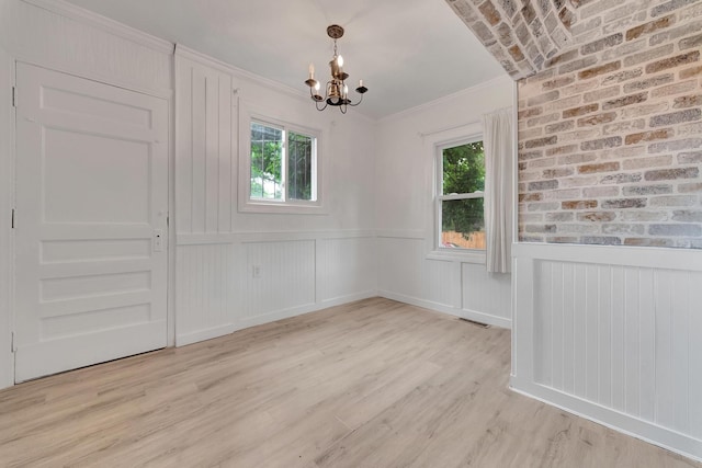 18600 Monica St, Detroit, MI 48221 - unfurnished dining area with a chandelier, wainscoting, light wood-type flooring, and crown molding