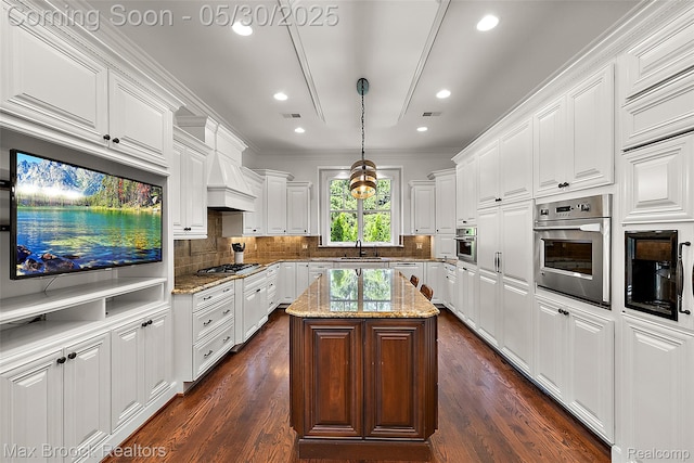 222 Arlington St, Birmingham, MI 48009 - kitchen featuring stainless steel appliances, a sink, recessed lighting, white cabinetry, and a center island