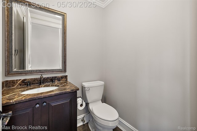 222 Arlington St, Birmingham, MI 48009 - bathroom featuring toilet, vanity, and baseboards