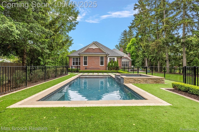 222 Arlington St, Birmingham, MI 48009 - back of house featuring brick siding, a pool with connected hot tub, and a chimney