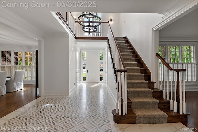 222 Arlington St, Birmingham, MI 48009 - entrance foyer featuring a chandelier, stairs, ornamental molding, baseboards, and a high ceiling